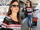 Staying under wraps! Alessandra Ambrosio hides her perfect figure in baggy boyfriend jeans 