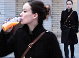 Drinking alone! Lonely Olivia Wilde sips from a bottle as she pines for boyfriend Jason Sudeikis during New York outing 